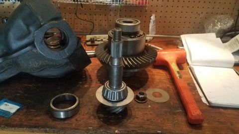 1985 Ford Bronco - Differential components laid out on a workbench, suggesting a repair or rebuild process.