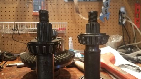 1985 Ford Bronco - Close-up of two differential pinion gears and their bearings, likely for automotive repair or upgrade.