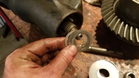 1985 Ford Bronco - Close-up of differential gears and shims, likely for a vehicle repair or rebuild.