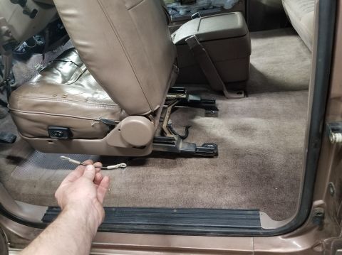 1993 Ford F-250 - Removing the limit strap from the driver's chair increases the rear access. The passenger chair doesn't have one.