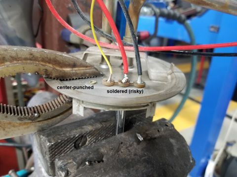 1993 Ford F-250 - The ground pin was loose on the tank plate, so I peened it over to tighten it down. The plastic insulator for the 3 other pins melts at a V…