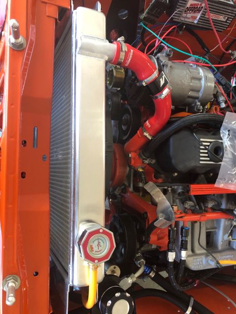 1992 Jeep Wrangler - Close-up of engine bay components including radiator, hoses, and AC compressor.