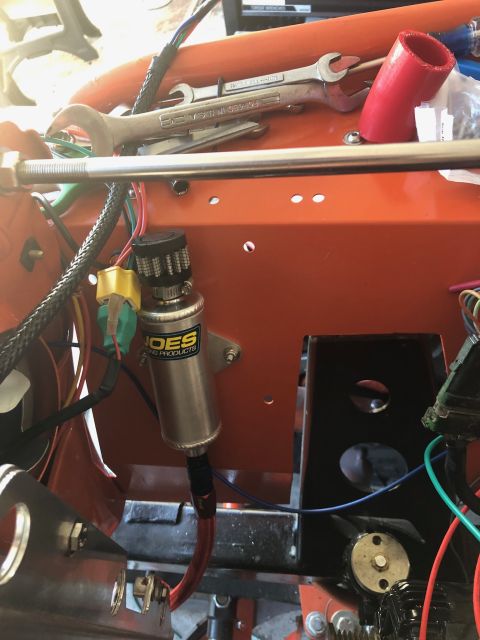 1992 Jeep Wrangler - Close-up view of engine bay components including a silver canister and various wires and hoses.