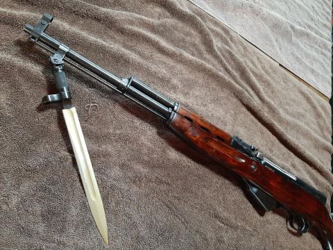 2003 Ford F-250 - An SKS rifle is shown with its bayonet fixed.