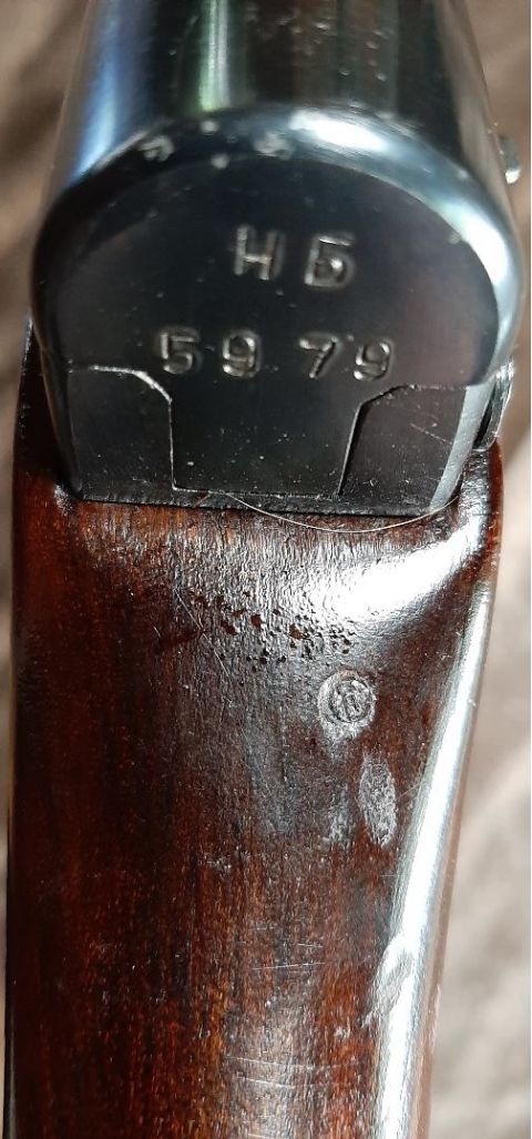 2003 Ford F-250 - Close-up of a firearm part showing the serial number 5979 stamped into the metal.