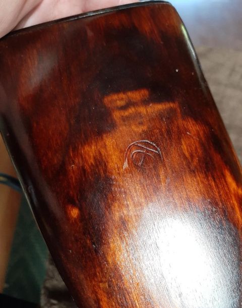 2003 Ford F-250 - Close-up of a wooden stock a circular emblem.