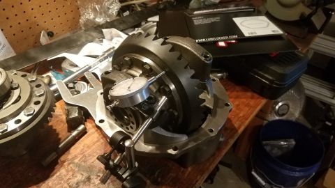 1985 Ford Bronco - Differential assembly with a dial indicator set up to measure gear backlash, likely during a rebuild or setup process.
