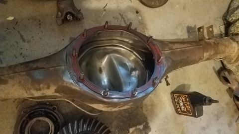 1985 Ford Bronco - A differential housing is shown with its cover removed, revealing the internal gears.