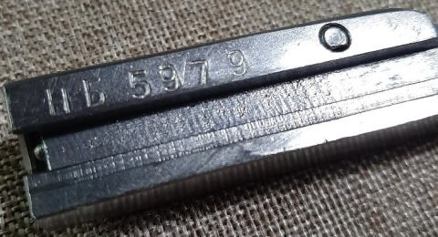 2003 Ford F-250 - Close-up of a metal part showing stamped identification numbers HB 5979.