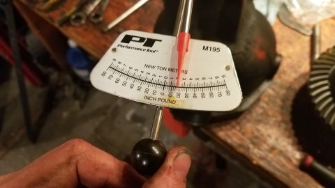 1985 Ford Bronco - A torque wrench is used to measure force on a differential gear, indicating a mechanical part rather than a full vehicle.