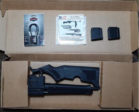 2003 Ford F-250 - A disassembled SU-16 rifle kit is shown in its original packaging with accessories.