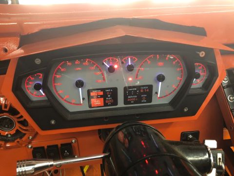 1992 Jeep Wrangler - Custom dashboard gauges with red backlighting and digital displays for clock, trip, and service information.