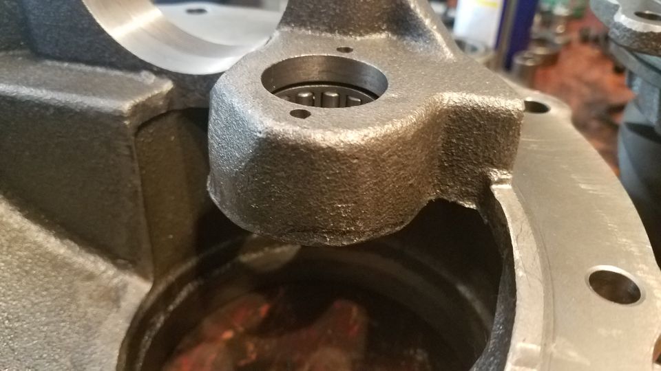 Cast iron automotive part with bearing installed