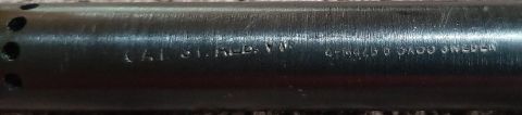 2003 Ford F-250 - Close-up of engraved text on a dark metallic cylindrical object, possibly a firearm barrel. The text reads "C.A.I. ST. A. VT." and "4-MAG-6…