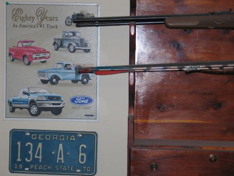 1995 Ford Bronco - Poster of Ford trucks and a Georgia license plate are displayed next to rifles.