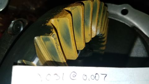 1985 Ford Bronco - A close-up view of a differential gear with yellow marking compound applied to the teeth. Text at the bottom of the image reads "2,031 @ 0.…