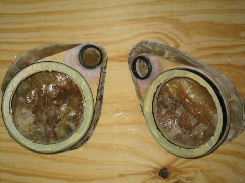 1989 Ford Bronco - A pair of hand-laid fiberglass speaker pods sitting face-up on a plywood bench, each with a large woofer ring and a smaller tweeter ring mo…
