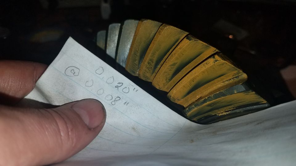 Differential gear with handwritten measurements on paper