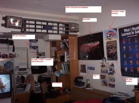 1988 Ford Bronco - A 1990 Ford F-150 grille and headlights are displayed on a wall above other posters and posters.