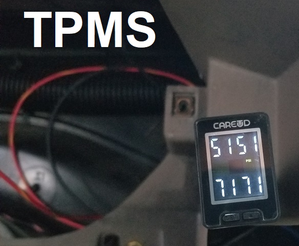 TPMS gauge showing 51 PSI and 71 PSI, with wiring visible
