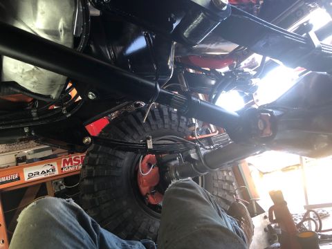 1992 Jeep Wrangler - Undercarriage view of a 1992 Jeep Wrangler, focusing on the suspension and drivetrain components.