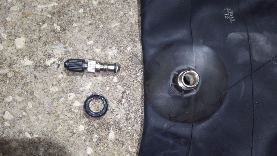 these Firestone 551236 tubes have a removeable stem for filling with water. i wont be using that feature but they do have a nut for retaining the stem in the hole of the wheel which i found is defiantly needed putting in a automotive wheel.

i was unable to find out what pitch thread the retainnig nut is. didnt seem to be any normal metric or american thread, very fine.