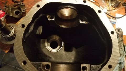 1985 Ford Bronco - This is a close-up view of an open differential housing, likely from a 1985 Ford Bronco, showing the internal bearing surfaces and mounting…