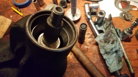 1985 Ford Bronco - A close-up view of a splined shaft inserted into a dark-colored metal housing, likely part of a vehicle's steering or drivetrain system. Va…