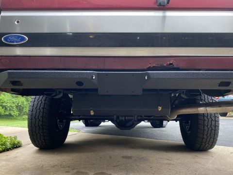 1994 Ford Bronco - Rear view of a 1994 Ford Bronco showing the bumper, axle, and exhaust system.