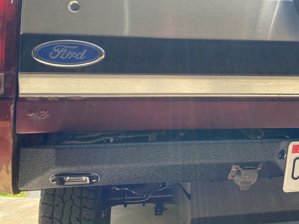 1994 Ford Bronco rear with Ford emblem and aftermarket bumper