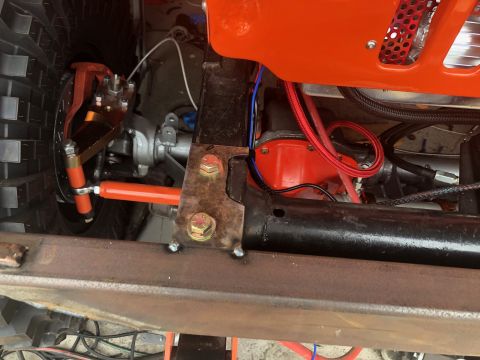 1992 Jeep Wrangler - Close-up view of custom off-road vehicle suspension and engine components, with visible branding from Supermotors.net.