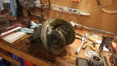 1985 Ford Bronco - Differential assembly and tools on a workbench. Album claims 1985 Ford Bronco.
