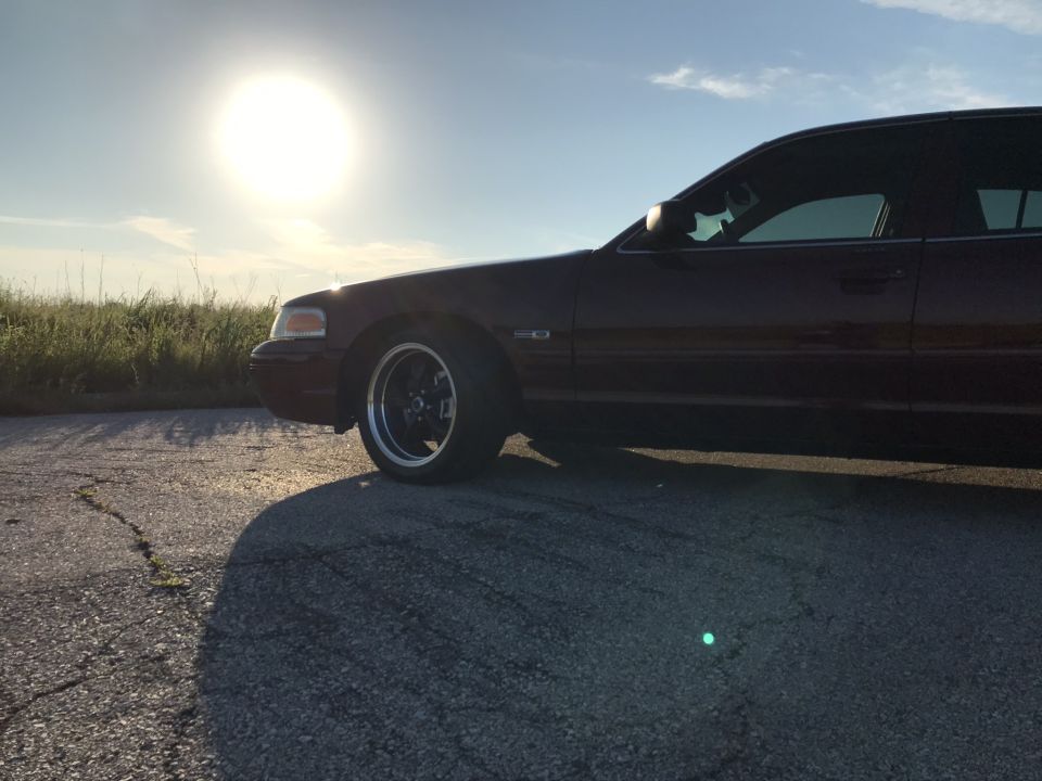 2004 Ford Crown Victoria side profile with aftermarket wheels