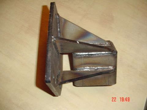 1989 Ford Bronco - A custom-fabricated metal bracket, likely for off-road vehicle modification, is shown in a close-up view.