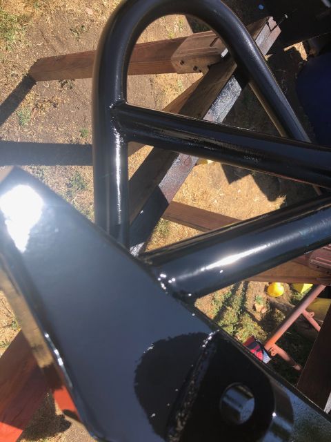 1992 Jeep Wrangler - Close-up view of black roll cage tubing, likely for an off-road vehicle.