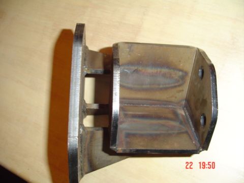 1989 Ford Bronco - Close-up of a custom-fabricated metal bracket, likely for automotive suspension.