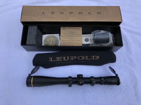 1995 Mercury Grand Marquis - A Leupold rifle scope and its accessories are laid out on a white surface, with the brand name clearly visible.