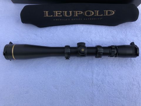 1995 Mercury Grand Marquis - A Leupold rifle scope is shown with its protective cover, which displays the brand's slogan.