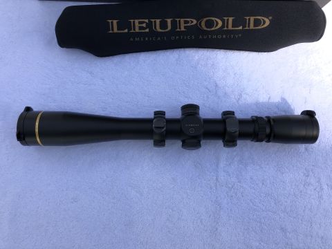 1995 Mercury Grand Marquis - A Leupold scope with its protective cover is shown. The scope has a black finish with gold trim and is mounted on rings.