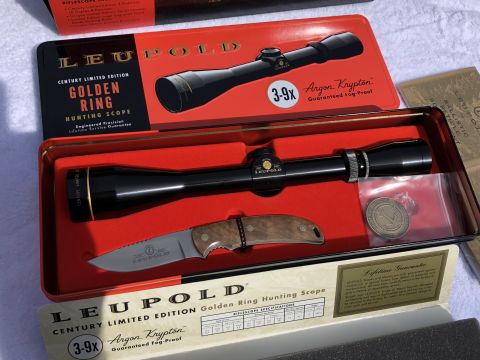 1995 Mercury Grand Marquis - A Leupold Golden Ring hunting scope and knife are displayed in their original packaging with product information.