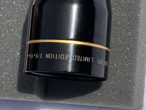 1995 Mercury Grand Marquis - Close-up of a black part with gold trim, showing 'CENTURY LIMITED EDITION 3-9x40mm' text.