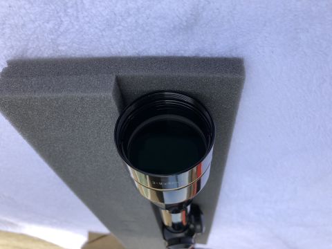 1995 Mercury Grand Marquis - A rifle scope is shown resting on foam padding, with text indicating its magnification and objective lens diameter.