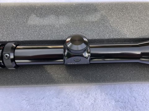 1995 Mercury Grand Marquis - A close-up view of a gun scope, showing the model number MMVII-1705B.