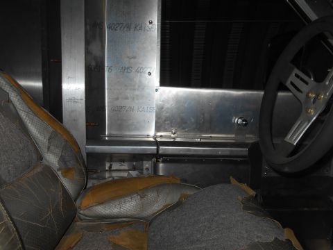 1992 Ford Bronco - Interior view shows worn seats and metal paneling with visible text indicating 'AMS 4027/N KAISER'.