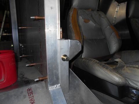 1992 Ford Bronco - Interior view of a vehicle showing damaged seats and custom metalwork.