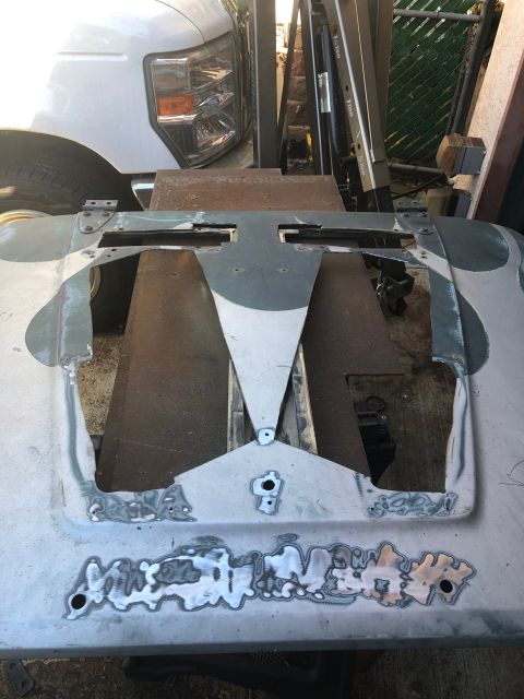 1992 Jeep Wrangler - This car hood is undergoing significant bodywork and repairs.