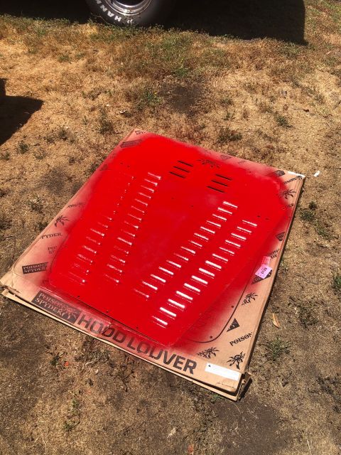 1992 Jeep Wrangler - A red hood louver part is shown on a cardboard box, with text indicating it's from Poison Spyder.