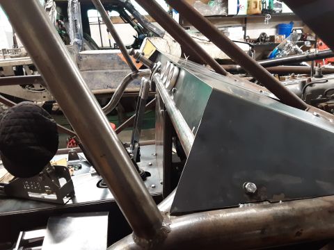 1985 Toyota Hilux - Interior view of a vehicle undergoing modifications with a prominent roll cage structure.