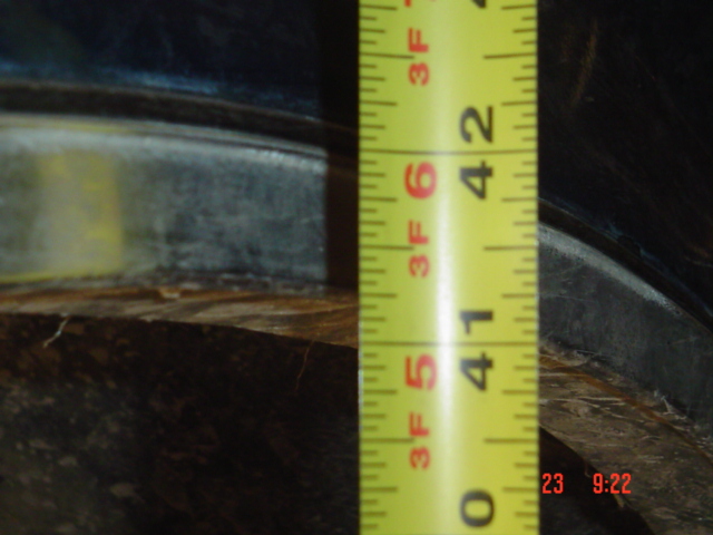 Measuring tape against dark vehicle frame, showing 41 inches