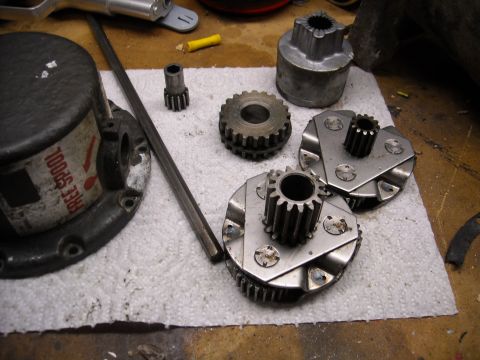 1992 Jeep Wrangler - A collection of gears and mechanical parts are laid out on a white paper towel, possibly for a vehicle repair or modification. Visible comp…